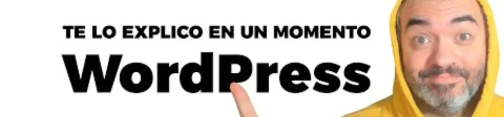 Explicación rápida de WordPress - La Máquina del Branding Imagen con un hombre de barba y sudadera amarilla señalando el texto "Te lo explico en un momento: WordPress" sobre fondo blanco.